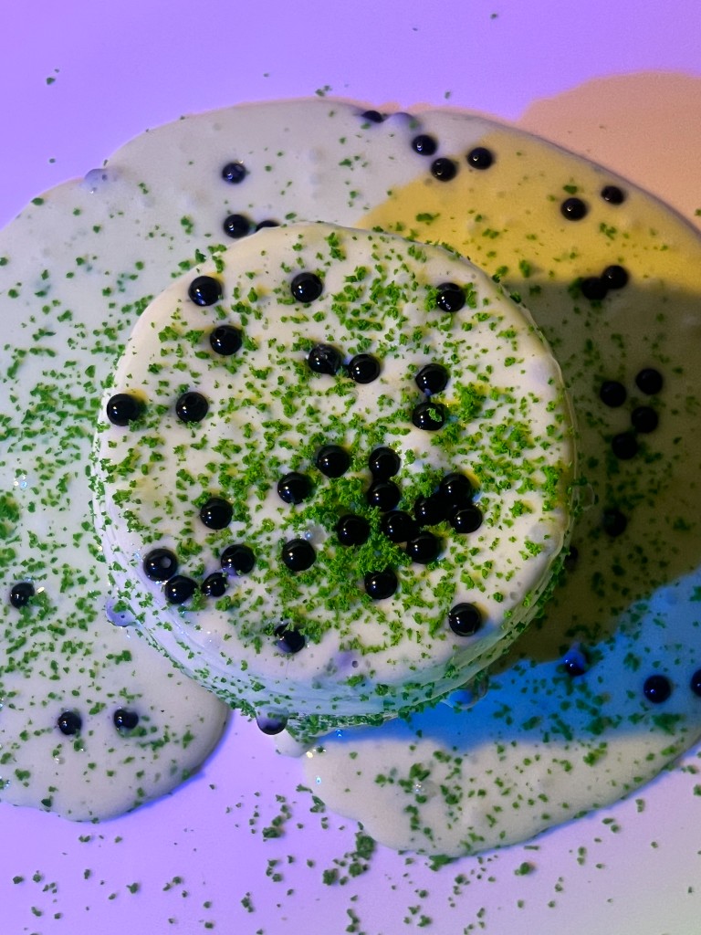 Matcha Boba slime from above, with pearls and matcha dust
